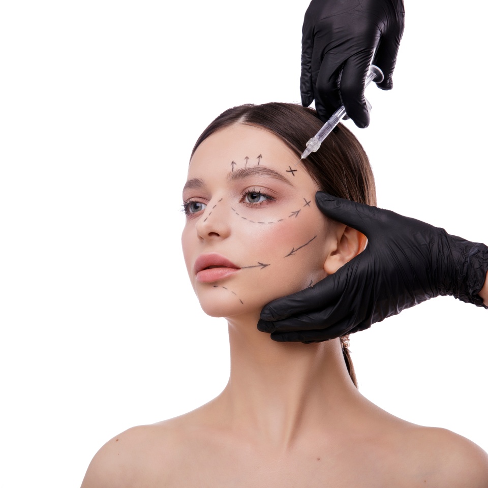 People, Lips, cosmetology, plastic surgery and beauty concept - beautiful young woman face and hand with syringe making injection