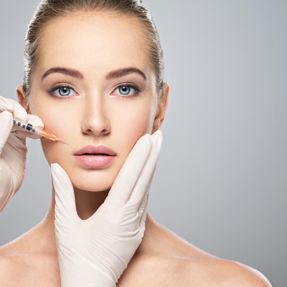 Woman getting cosmetic injection of botox near lips, closeup. Woman in beauty salon. plastic surgery clinic.