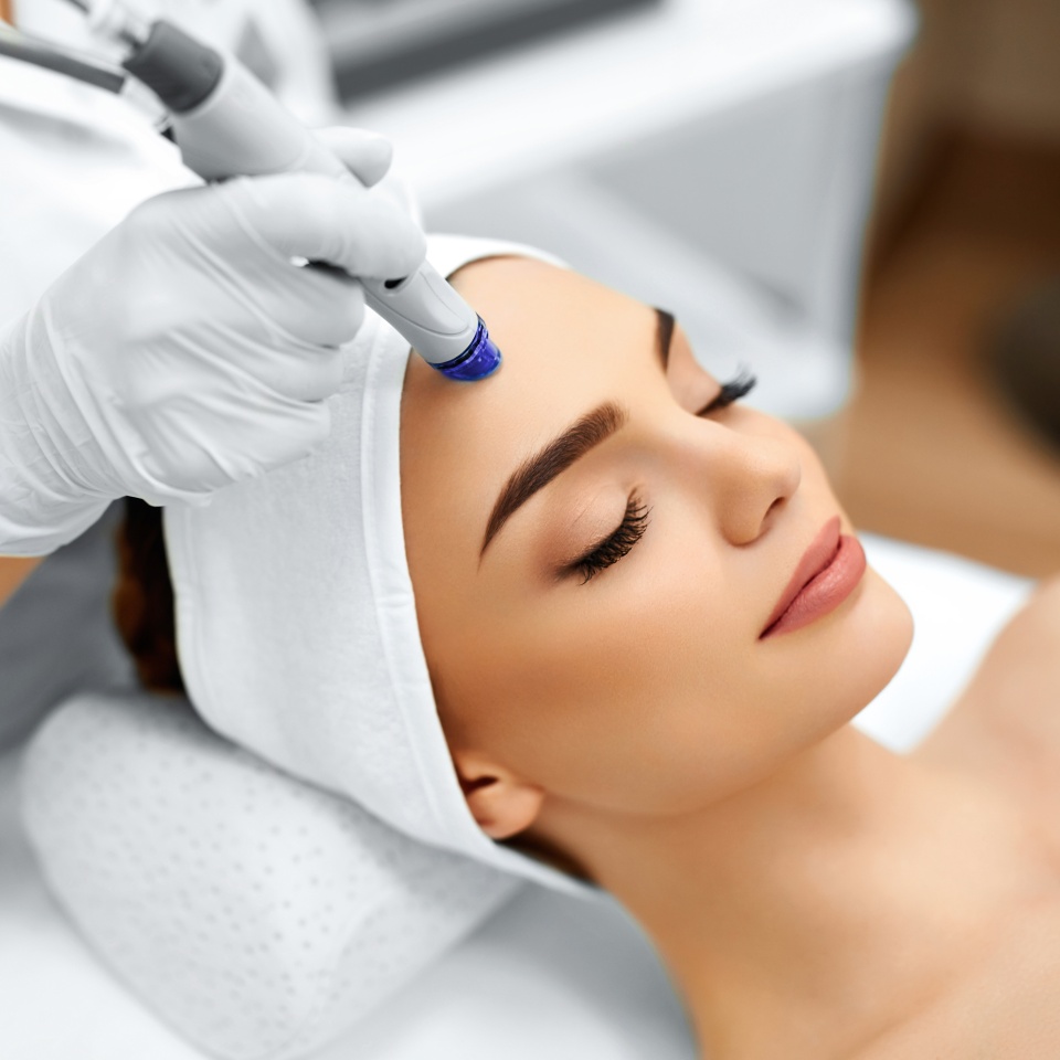 Face Skin Care. Close-up Of Woman Getting Facial Hydro Microdermabrasion Peeling Treatment At Cosmetic Beauty Spa Clinic. Hydra Vacuum Cleaner. Exfoliation, Rejuvenation And Hydratation. Cosmetology.